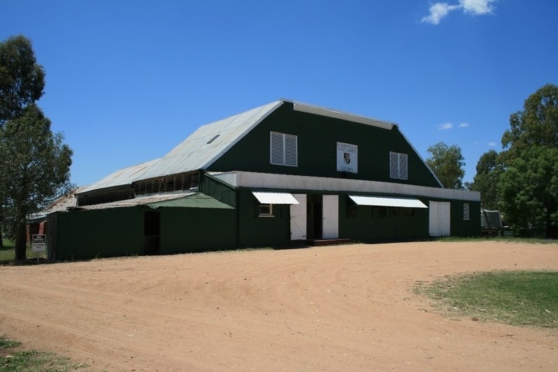 A green building with a high roof