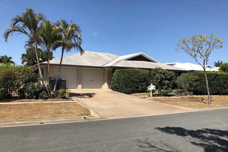 A photo of a modern brick house on a street in north Queensland.