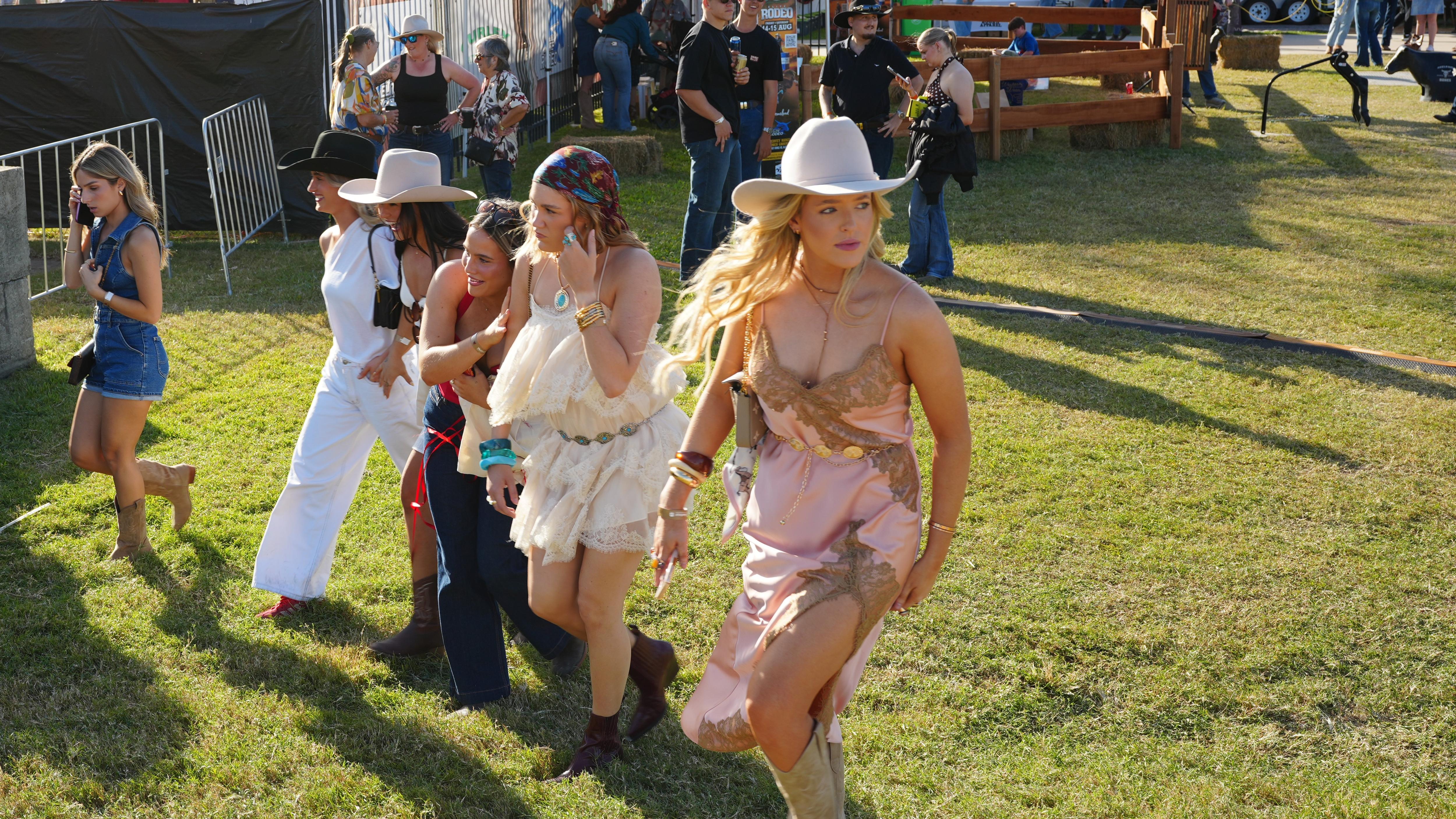 Young women at a country music festival.