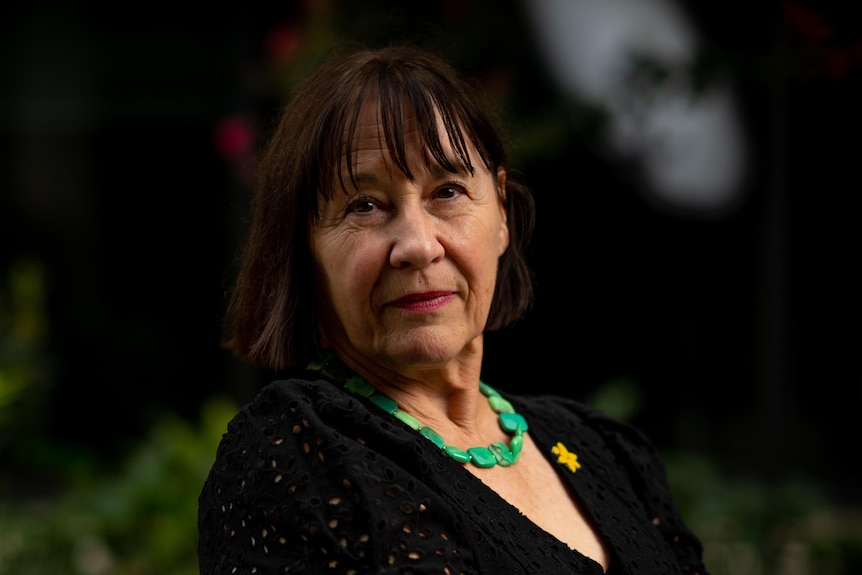 A woman wearing a black dress