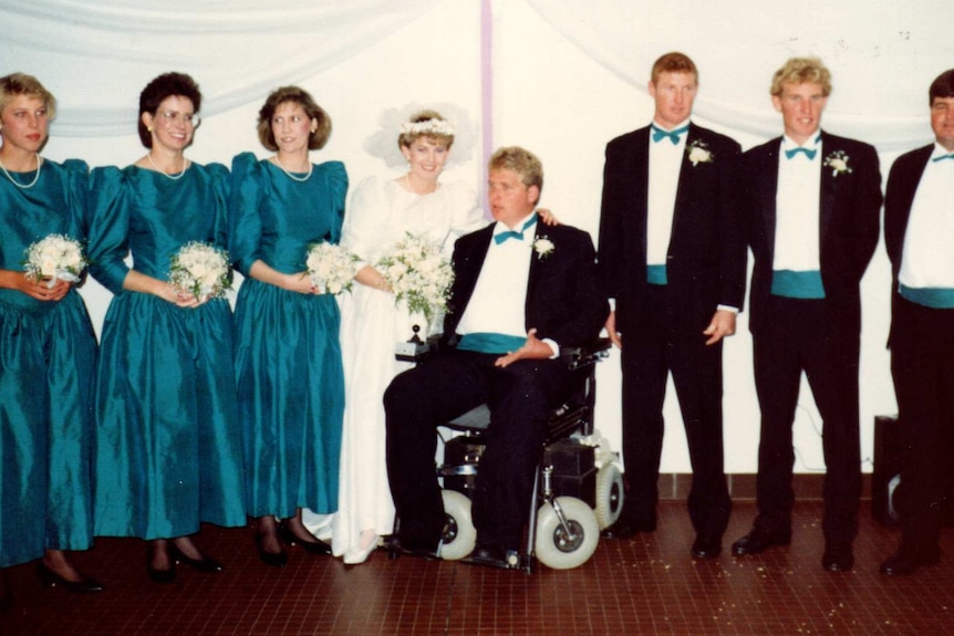 Four women and four men celebrate a wedding day.