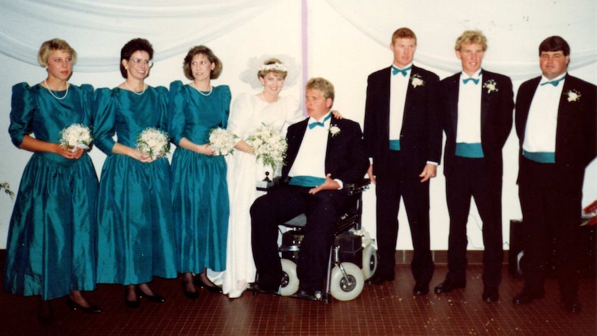 Four women and four men celebrate a wedding day.