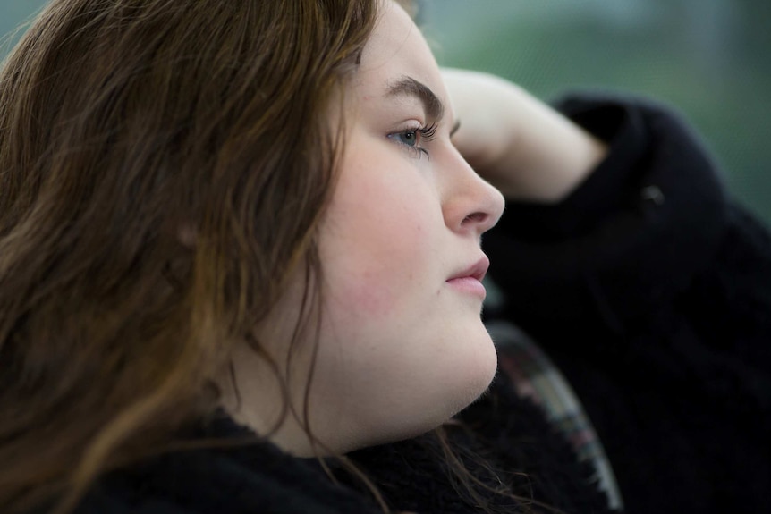 Second year Arts student Molly Willmott rests her head on her hand.