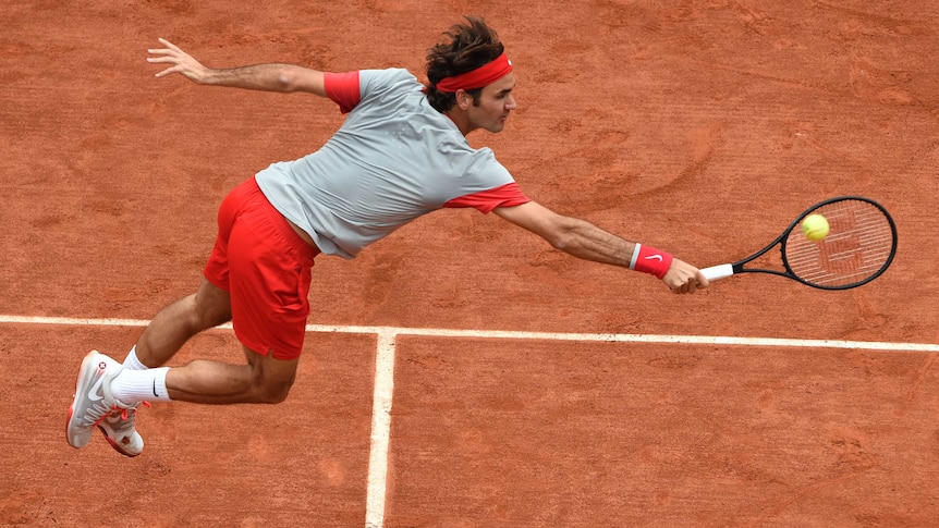 Roger Federer stretches at French Open
