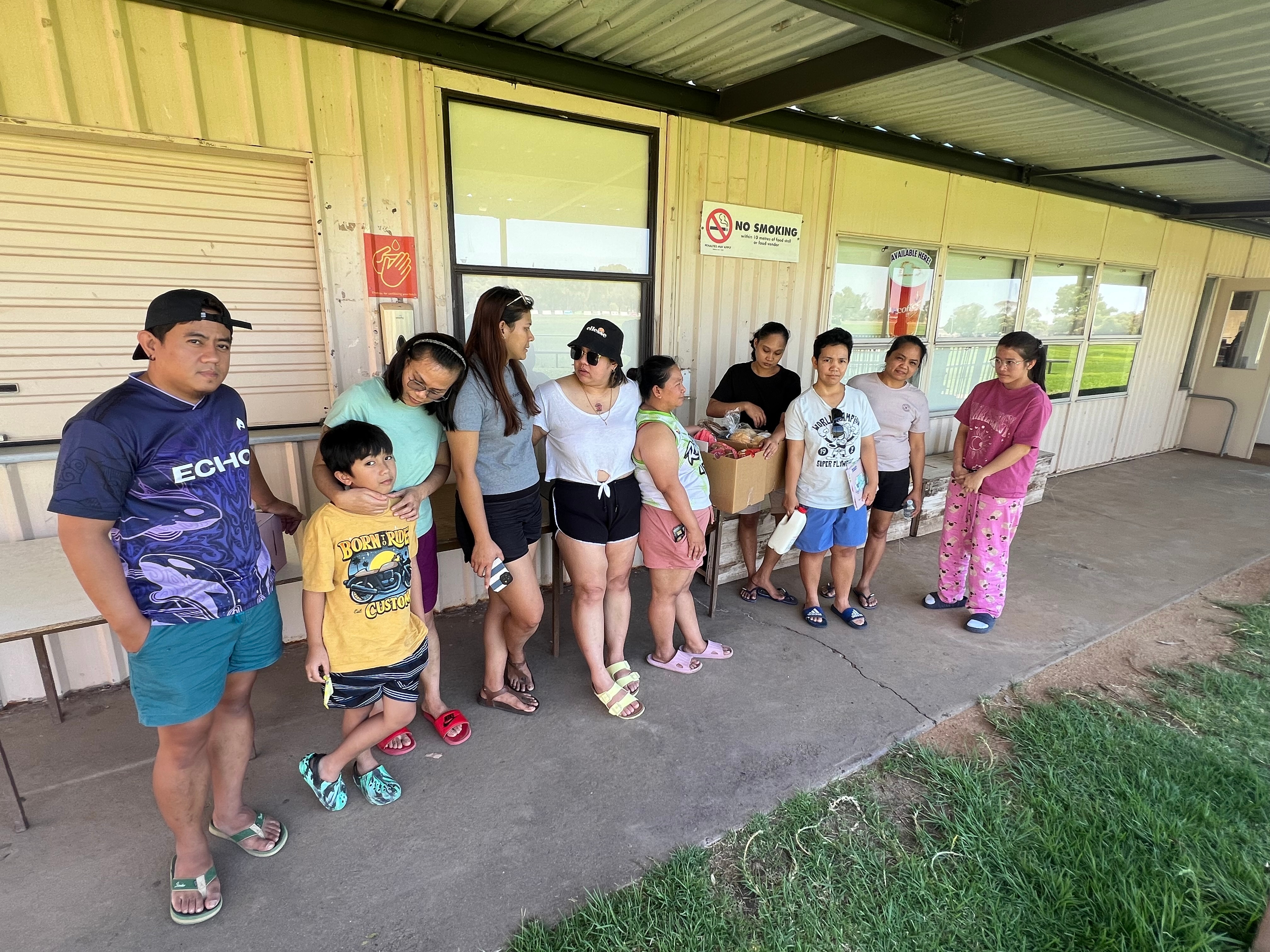 People gather outside a building