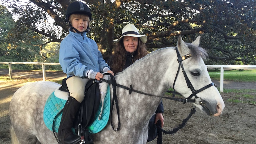 Vanessa Edsworthy and he son Lochy Colquhoun, who is sitting on a horse.