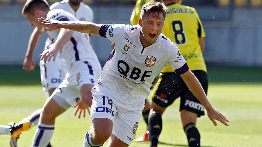 Perth Glory's Chris Harold (c) celebrates his goal against the Phoenix in the A-League match in Wellington, on February 7, 2016.