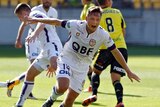 Perth Glory's Chris Harold (c) celebrates his goal against the Phoenix in the A-League match in Wellington, on February 7, 2016.