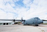 The RAAF 37 Squadron's C-130J-30 sits in waiting on the Edinburgh tarmac.