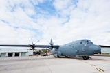 The RAAF 37 Squadron's C-130J-30 sits in waiting on the Edinburgh tarmac.