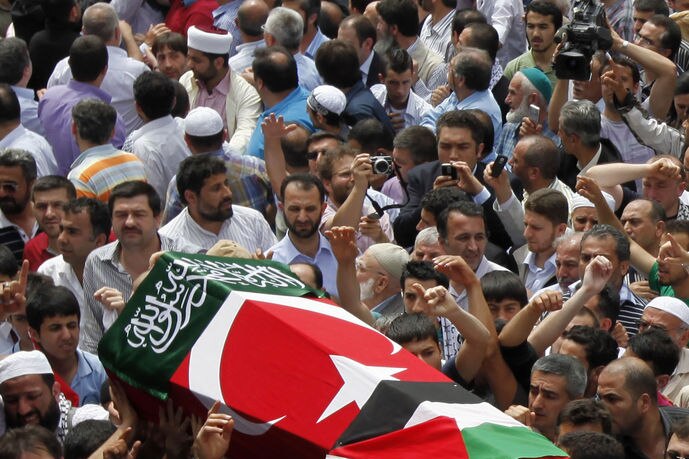 Relatives carry the coffin of an Turkish activist killed when Israeli commandos stormed an aid ship.