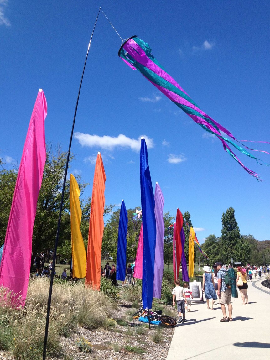 Flags on the shores of Lake Burley Griffin as part of Canberra's centenary celebrations.
