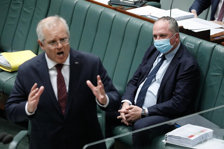Barnaby Joyce watches on as Scott Morrison speaks in the House of Represenatives
