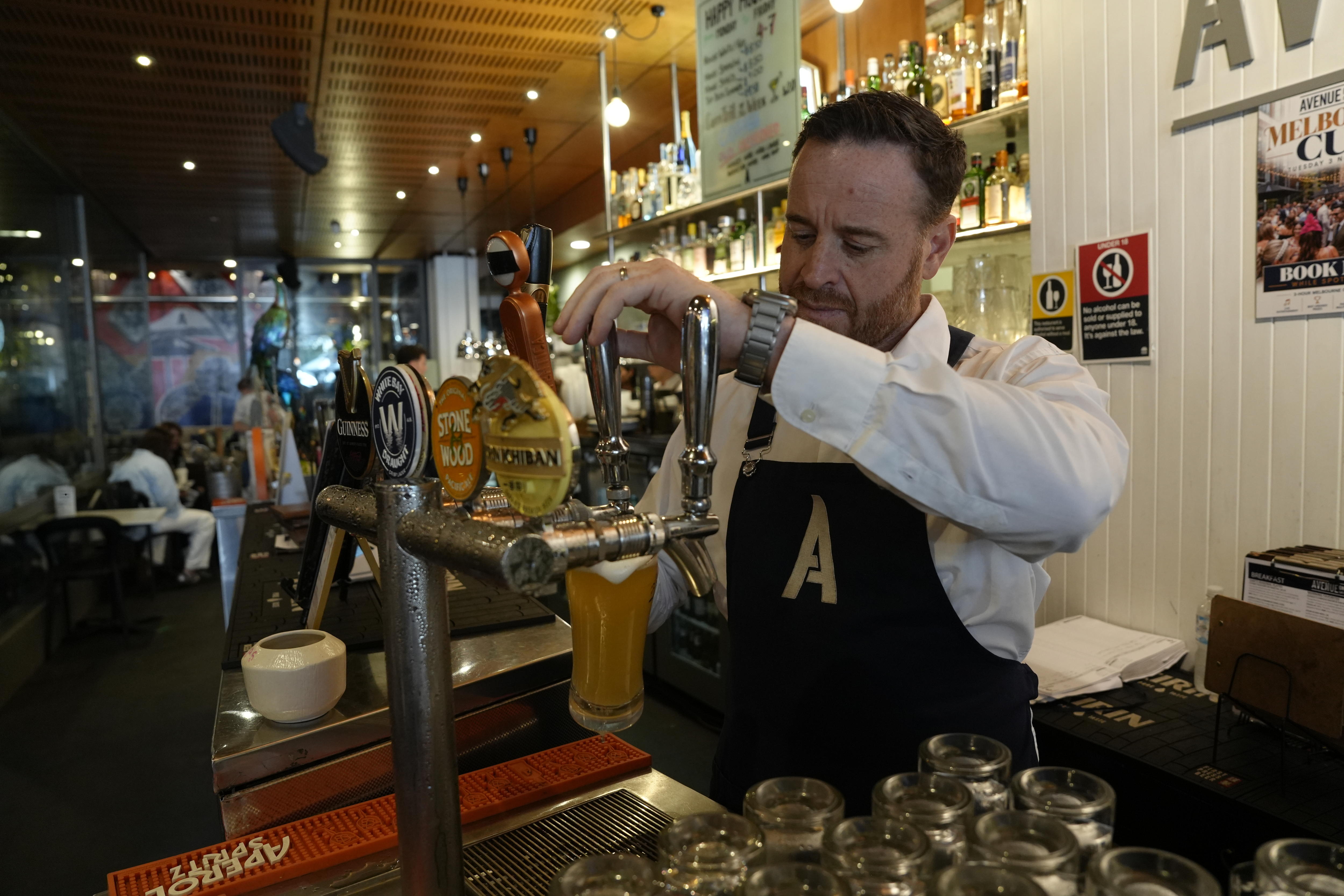 Philip Barbaro cafe and hospitality venue owner pours beer