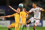 Tomi Juric heads the ball while Ismail Ahmed looks on.