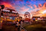 The Warrnambool carnival rides and people at dusk
