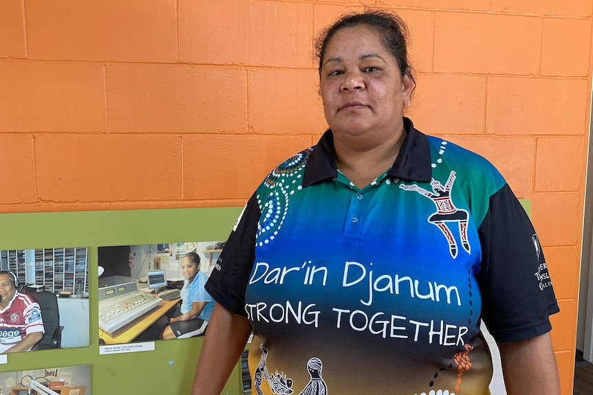 A woman wearing a t-shirt that says Stronger Together.