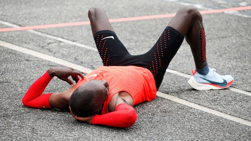 Eliud Kipchoge reacts after crossing finish line