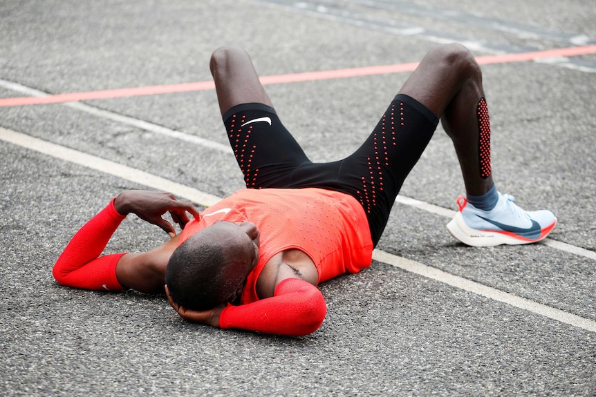 Eliud Kipchoge reacts after crossing finish line