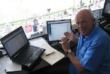 Kerry O'Keeffe in the broadcast box at the Gabba in Brisbane.