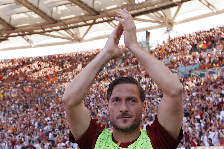Francesco Totti salutes the crowd in his last game for Roma.
