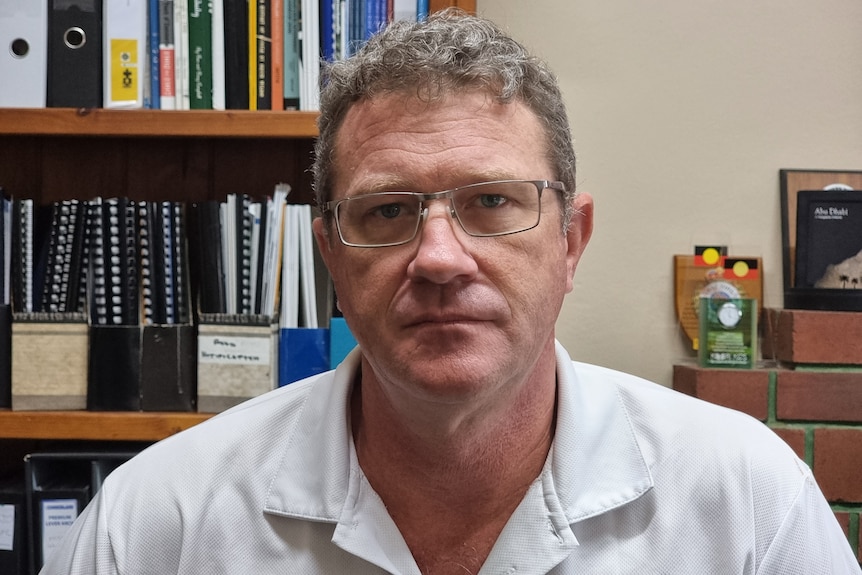 Graham Kennett at his desk.