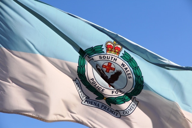NSW police logo on a flag in Newcastle