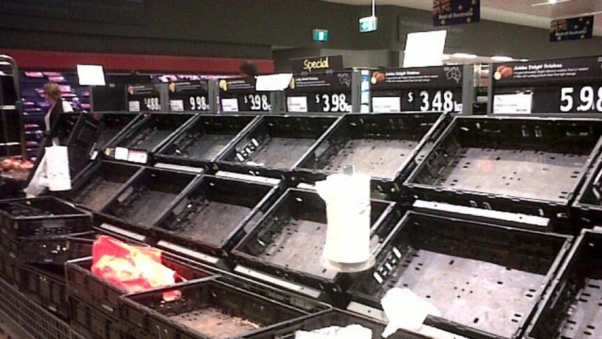 Fruit baskets are empty at Woolworths in Ashgrove ahead of a predicted flood peak in Brisbane