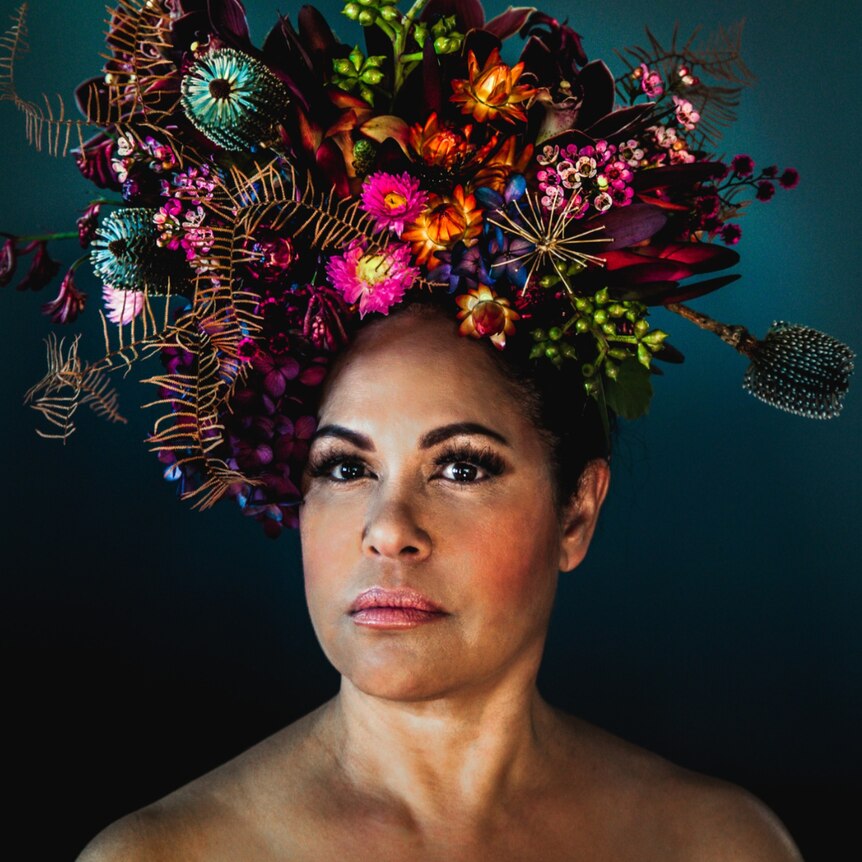Christine Anu wearing a vibrant flower crown