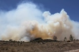 Plumes of smoke from a hill