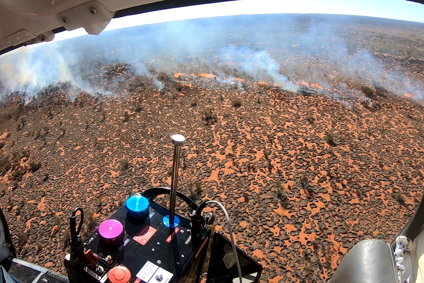 The view of set fires from inside a helicopter.