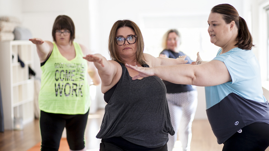 Sarah Harry instructs women in one of her Fat Yoga classes.