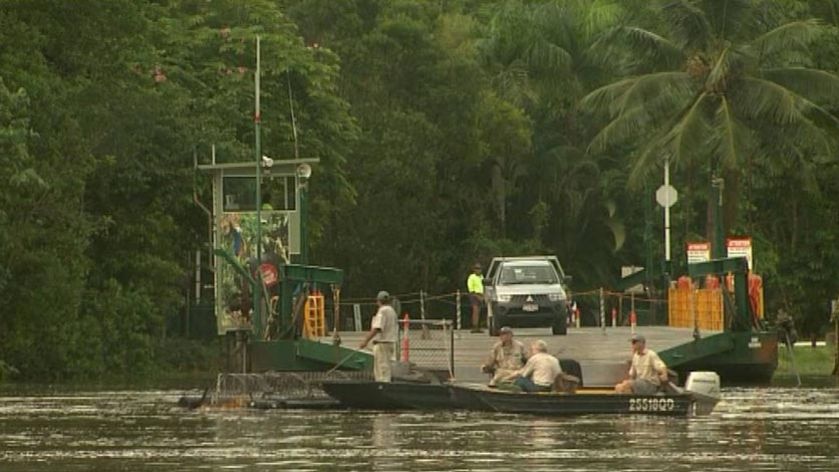 TV still authorities and boats on the Daintree River on February, 9, 2009 searching for missing 5yo