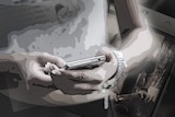 A manicured hand holds a mobile phone in a black and white graphic.