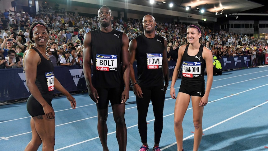 Usain Bolt (C L), Asafa Powell (C R) and the All-Stars team after mixed relay at Nitro Athletics.