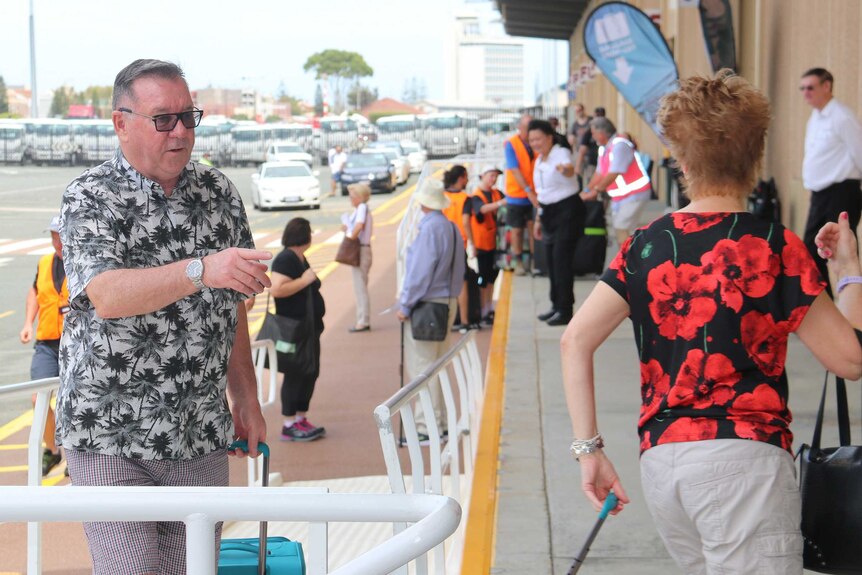 A crowd of people outside the Fremantle cruise ship passenger terminal.