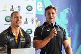 Wallabies' skipper Michael Hooper (R) speaks with David Pocock on at a media event in February 2018.