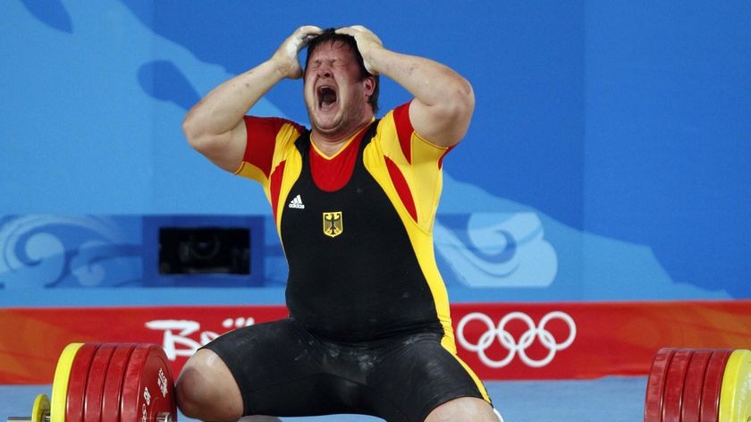 Matthias Steiner shouts with joy after lifting 258kg in the clean and jerk