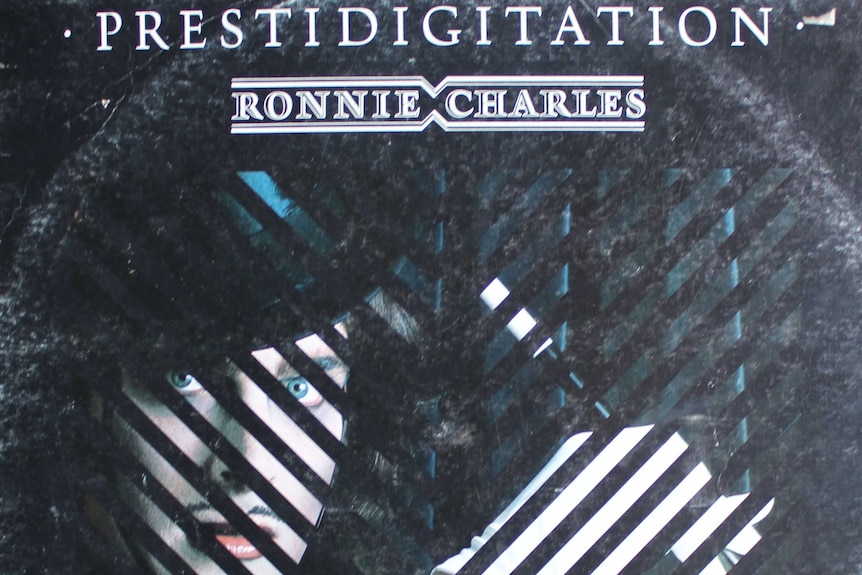 Album cover of Prestidigitation, with vocalist Ronnie Charles in a top hat