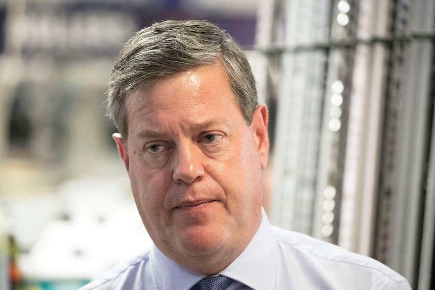 Queensland LNP leader Tim Nicholls listening intently on the Queensland election trail in Brisbane