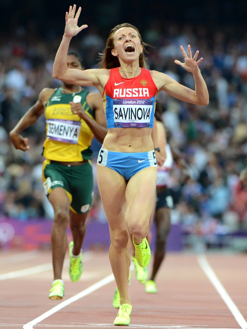Mariya Savinova raises her arms in celebration as she wins the 800m final at the London Olympic Games.