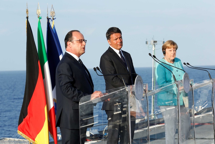 Matteo Renzi, Angela Merkel and Francois Hollande at a press conference.