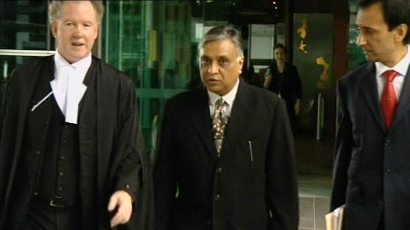 Patel (centre) faces 14 charges including three of manslaughter from his time working at Bundaberg hospital.