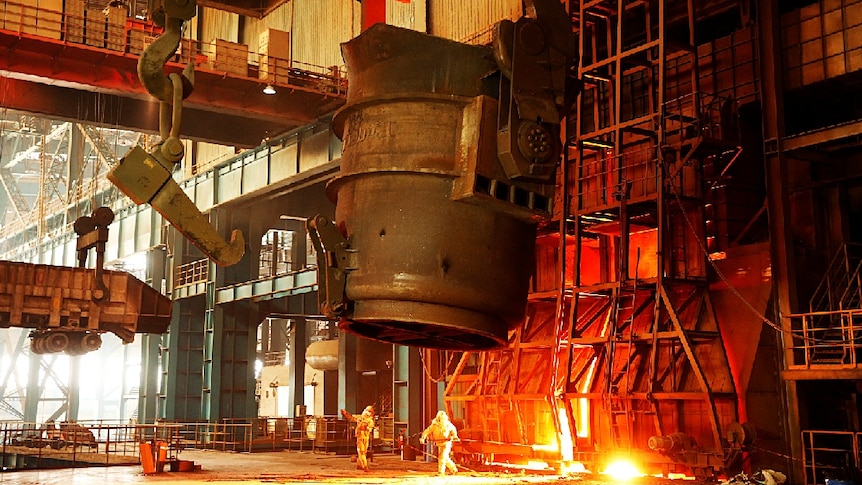 A steel foundry on the outskirts of Beijing pouring molten iron ore.