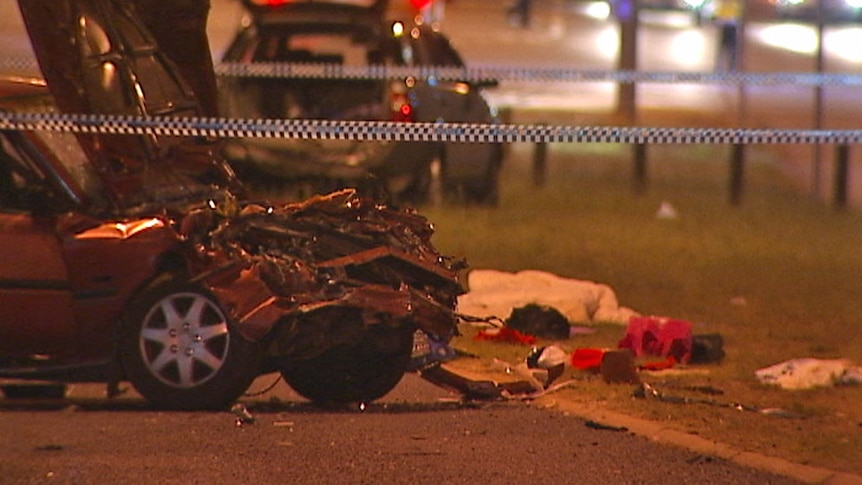 A woman has died after being hit by a car which ran a red light at a pedestrian crossing outside the Canberra Hospital.