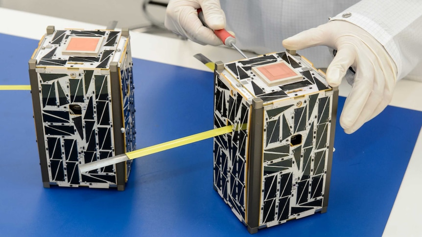 CubeSats, or nanosatellites, are prepared for launch