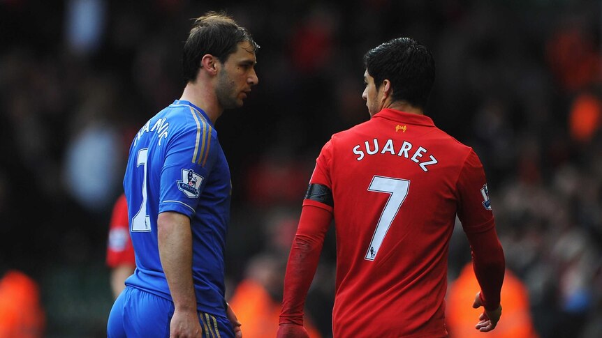 Ban accepted ...  Luis Suarez (L) and Branislav Ivanovic exchange words at Anfield
