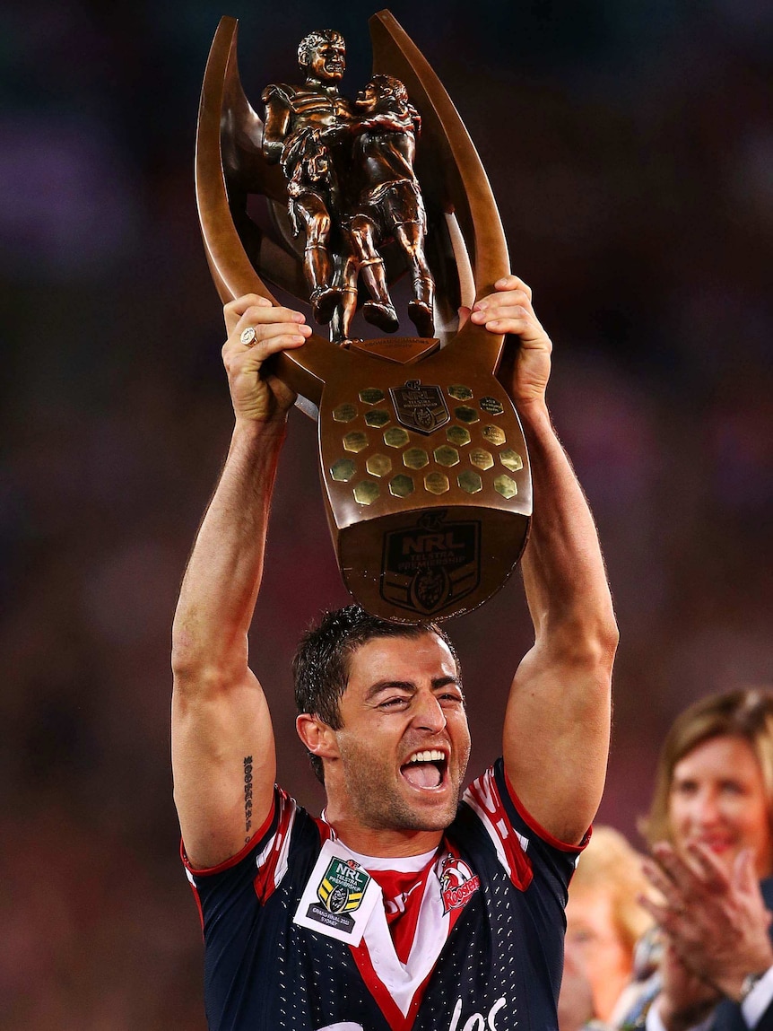 Anthony Minichiello lifts the trophy