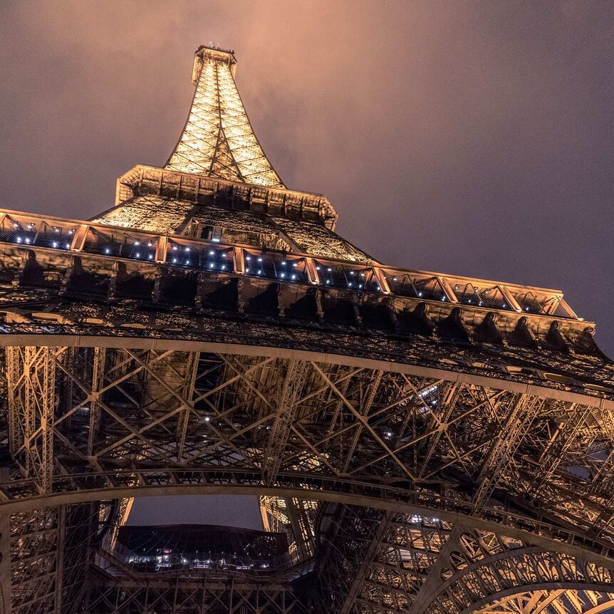 Looking up to the Eiffel Tower from below. (Image by Pexels from Pixabay)