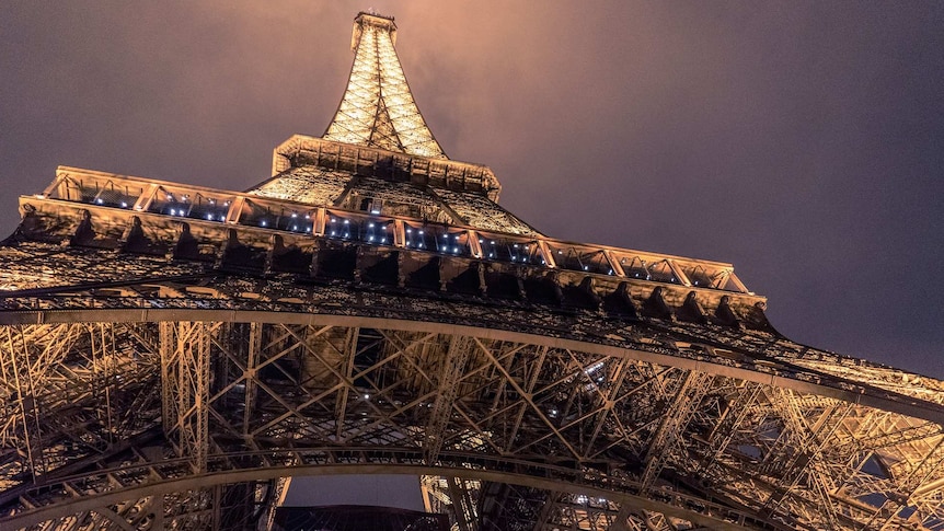 Looking up to the Eiffel Tower from below. (Image by Pexels from Pixabay)